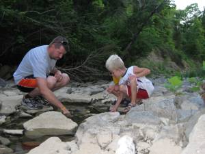 Looking for crawdads in the creek.